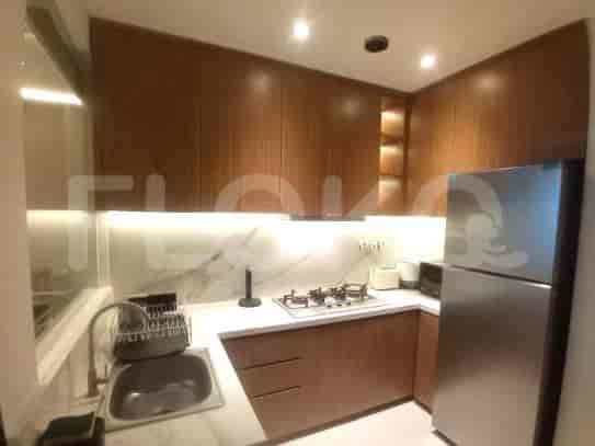 Kitchen with wooden cabinets and stainless steel appliances.