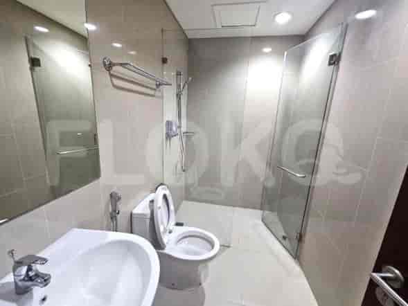Modern bathroom featuring a glass shower enclosure and a white vanity.