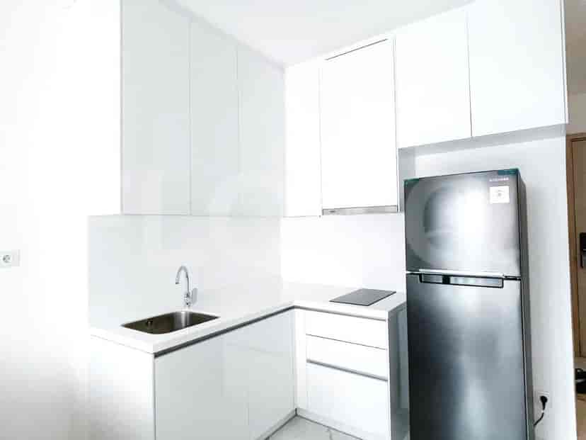 Modern kitchen with white cabinets, stainless steel appliances, and a minimalist design.