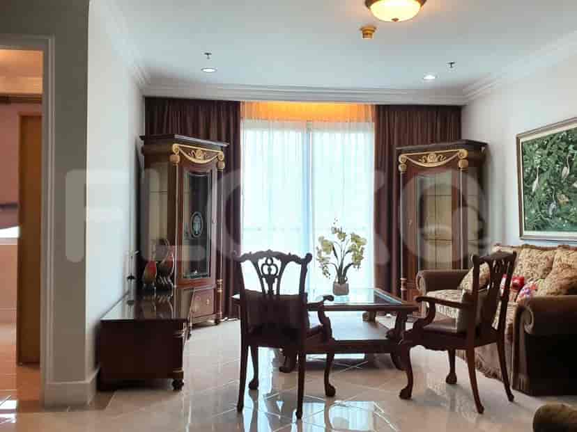 Elegant living room with traditional furniture and warm lighting.
