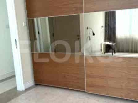 Bedroom with a large closet and mirror doors.