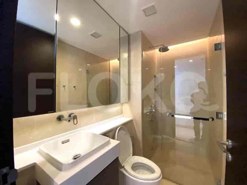 A modern bathroom with a glass shower and elegant fixtures.