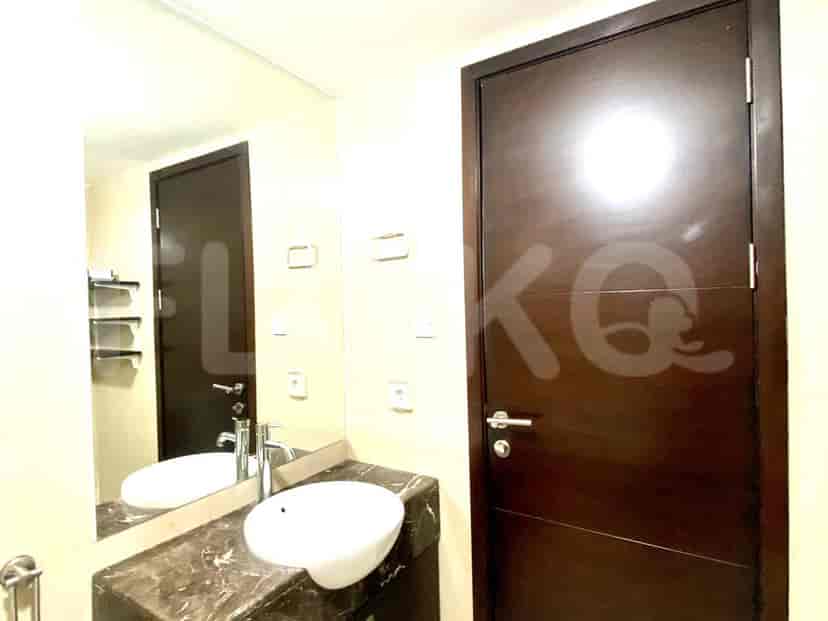 A modern bathroom with a sink and mirror.