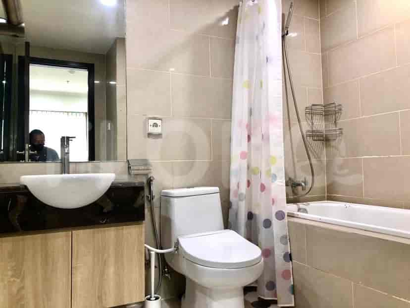 A modern bathroom featuring a sink, toilet, shower, and elegant design.