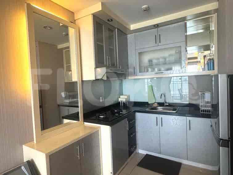 Modern kitchen with cabinets and a gas stove.