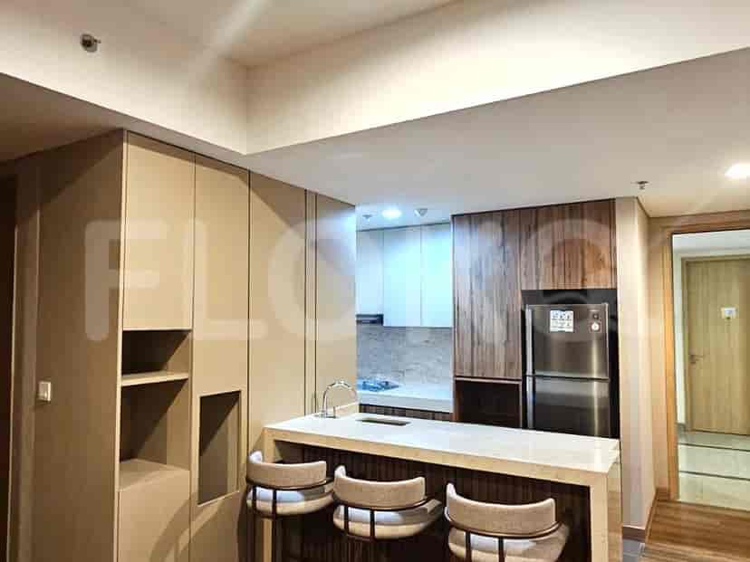 A modern kitchen with a breakfast bar and a minimalist design.