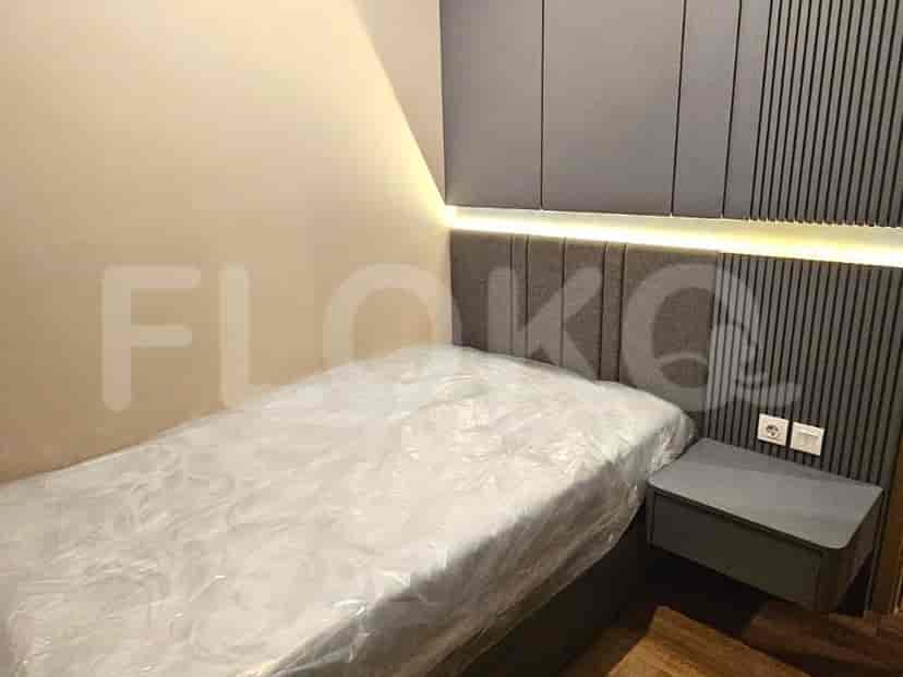 A second bedroom with a single bed and modern design.