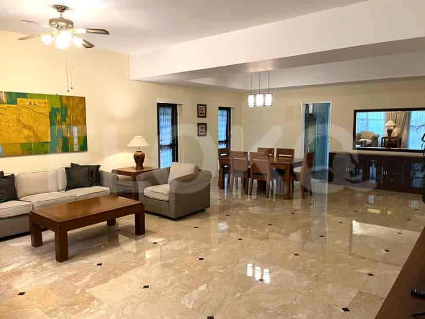 Spacious living and dining area with marble floors and elegant furnishings.