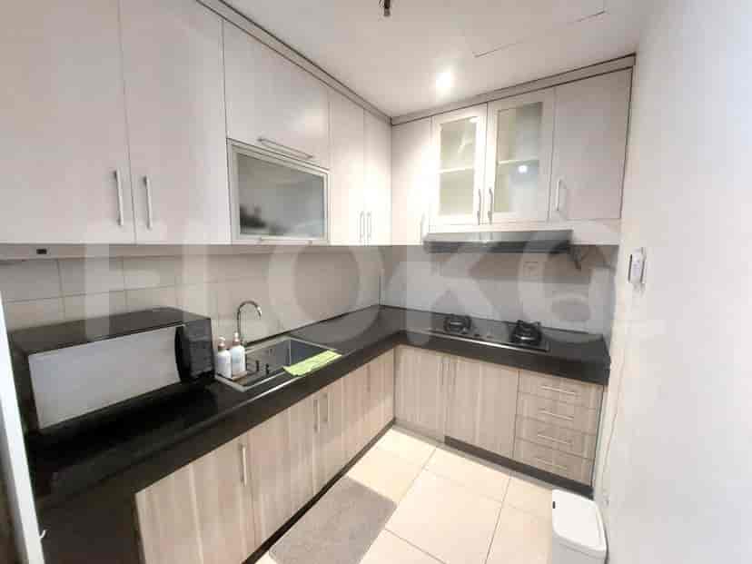 Functional kitchen with built-in appliances and ample storage.
