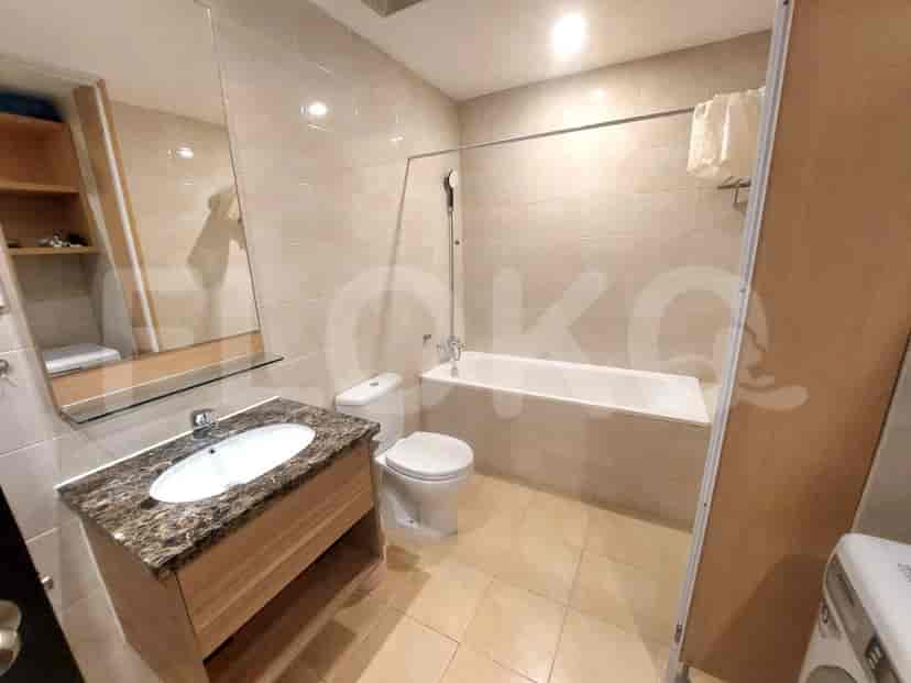 Bathroom with a bathtub, sink, and toilet.