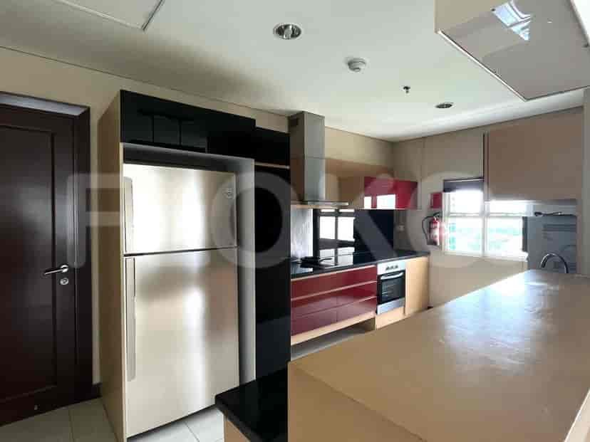 A modern kitchen with appliances and cabinetry.