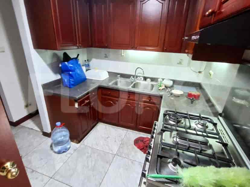 Kitchen with cabinetry, stove, and sink.
