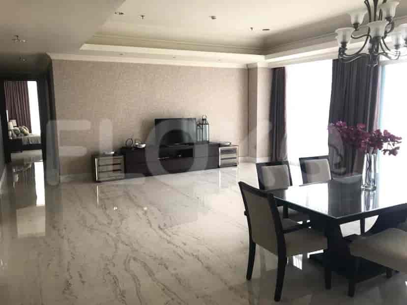 Spacious living room with a dining area, featuring marble flooring, a dining table, and a view.