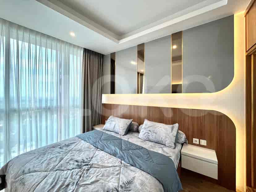 Contemporary bedroom with a queen bed, modern headboard, and large window.