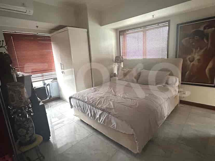 Bedroom with a bed, closet, and window with blinds.