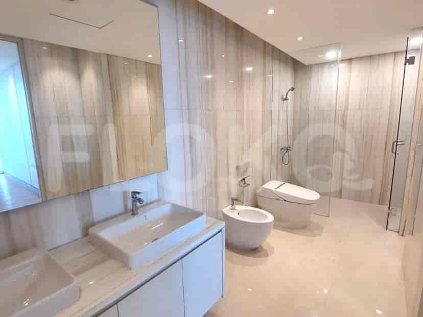 Modern bathroom with marble walls and flooring.