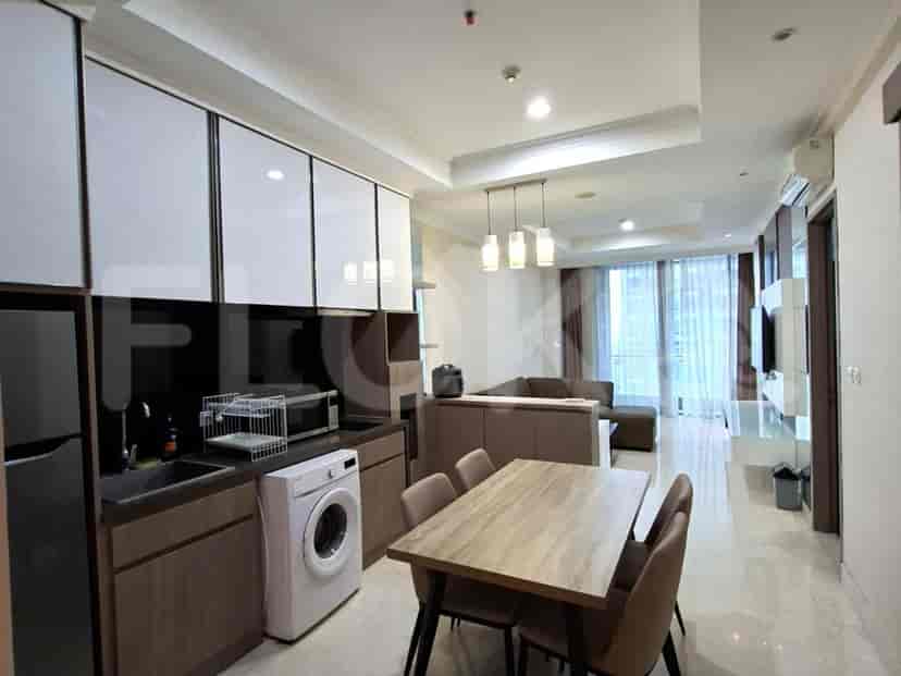 A fully equipped modern kitchen with a dining table.