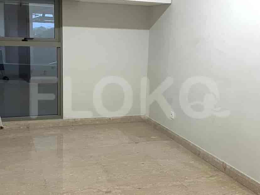 An empty bedroom with a large window and marble flooring.