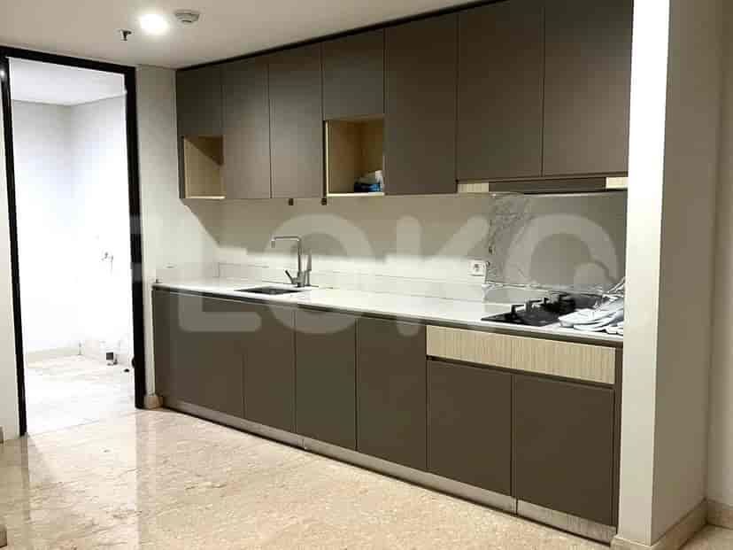 A modern kitchen with cabinets, a sink, and a stovetop.