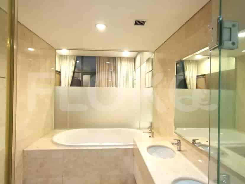 Bathroom with a bathtub and large mirror.