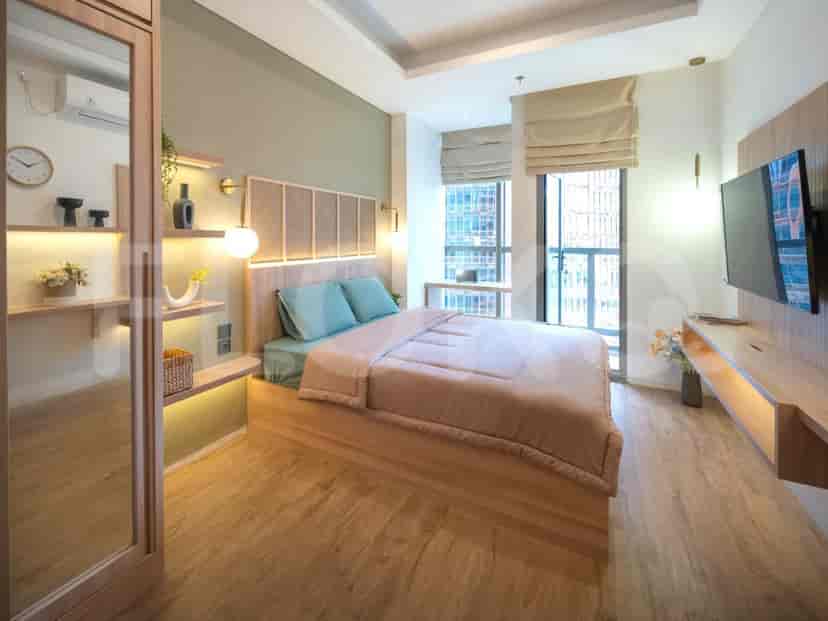 Another view of a modern bedroom, showcasing a wardrobe with a mirror, a window, and a bed.