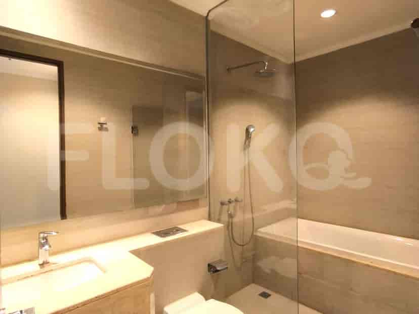A modern bathroom with a shower and a bathtub.