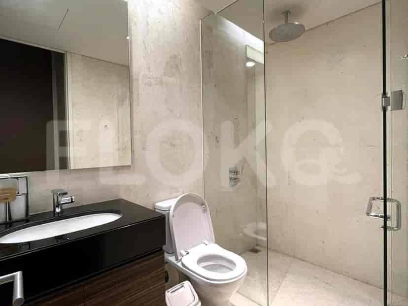 Modern bathroom with a shower, toilet, and vanity.