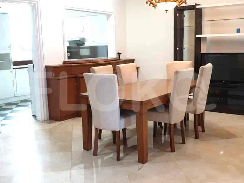 Dining area with a wooden dining table and six chairs.