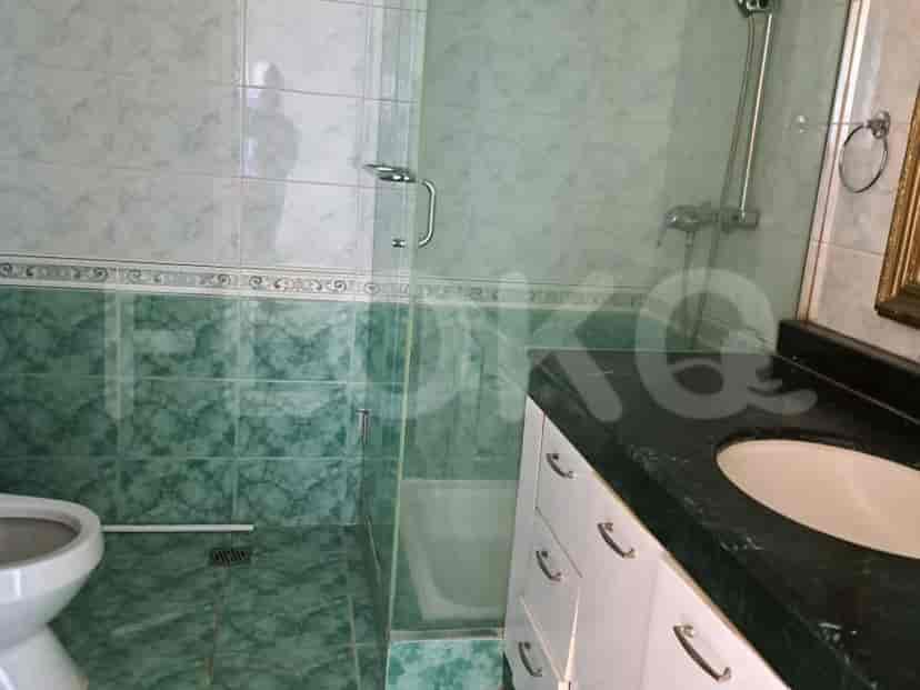 A bathroom with a shower and a toilet.