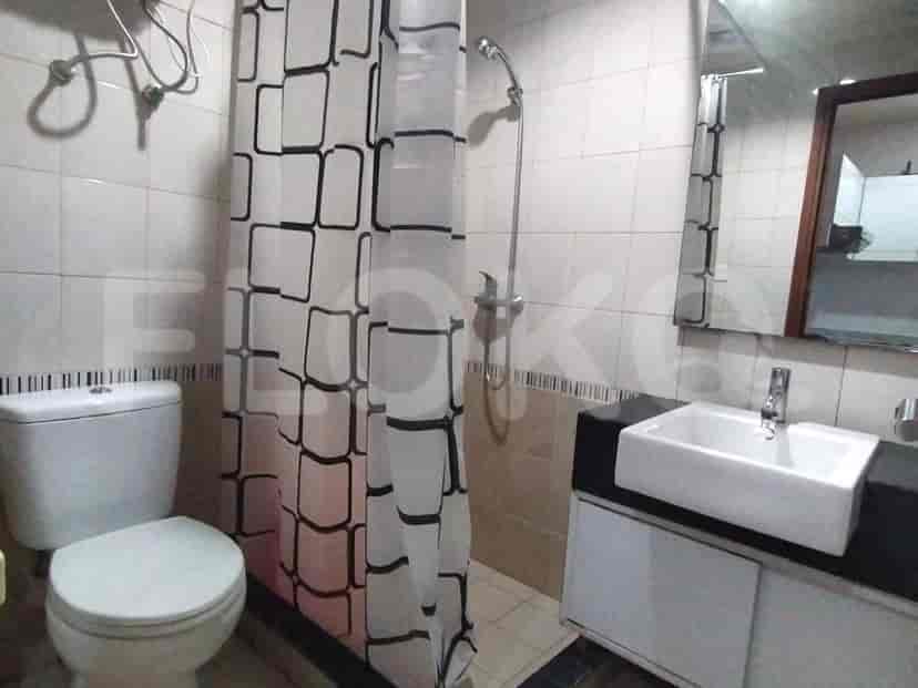 A bathroom featuring a toilet, a sink, and a shower.