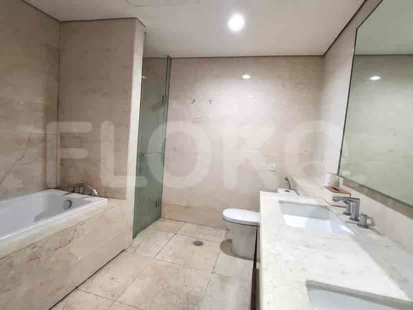 A bathroom with a bathtub, shower, sink and a toilet.