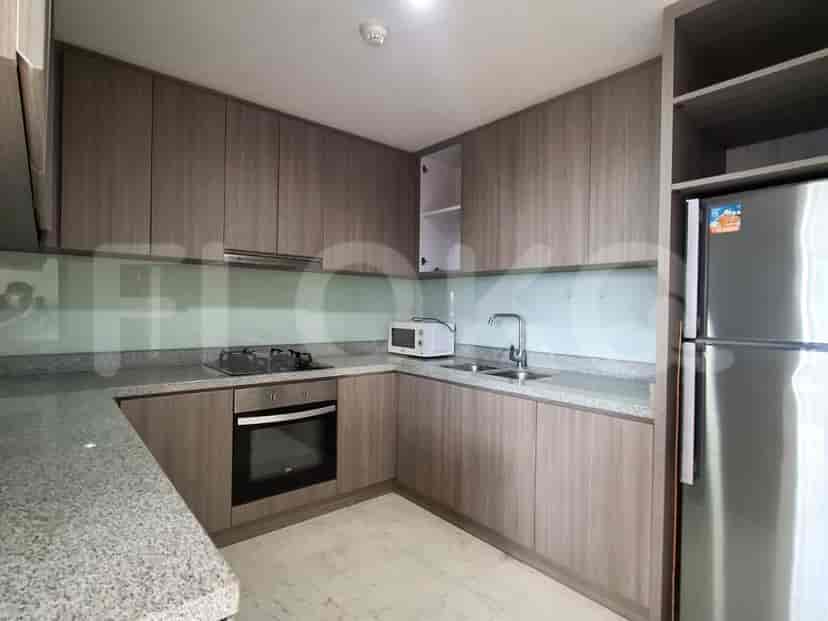 A kitchen with cabinetry, appliances, and a countertop.