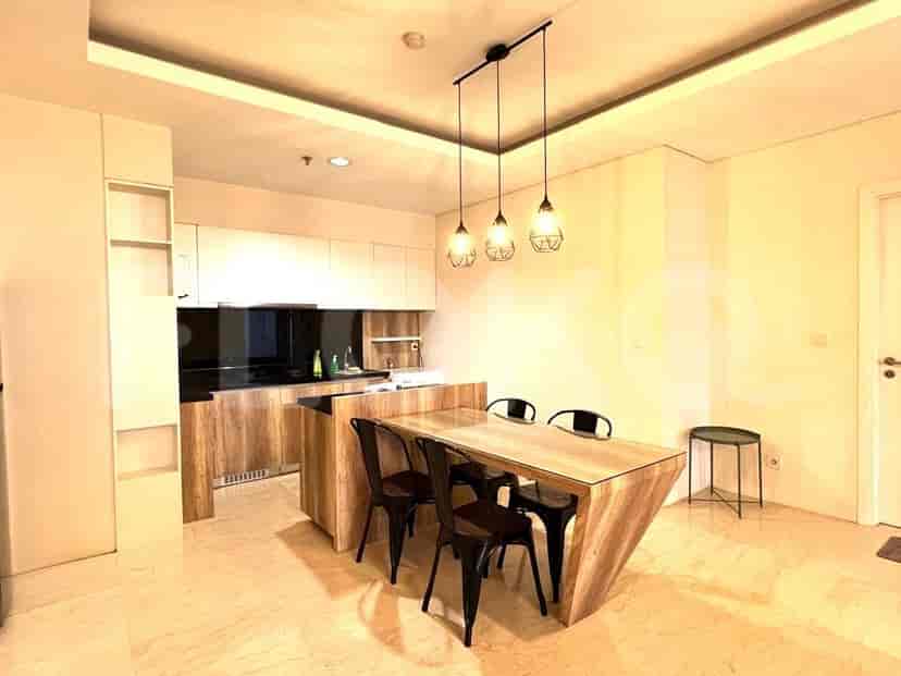 A kitchen with a dining table.