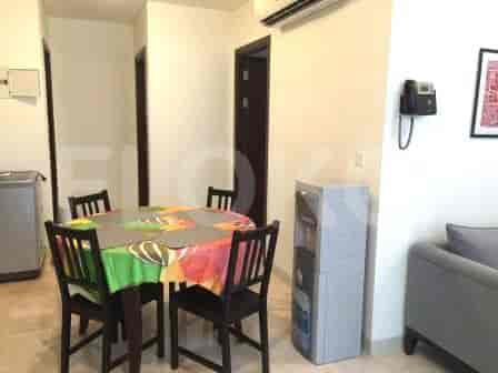 A dining area featuring a round table and chairs.