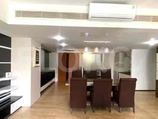 Dining area with a wooden dining table and chairs.