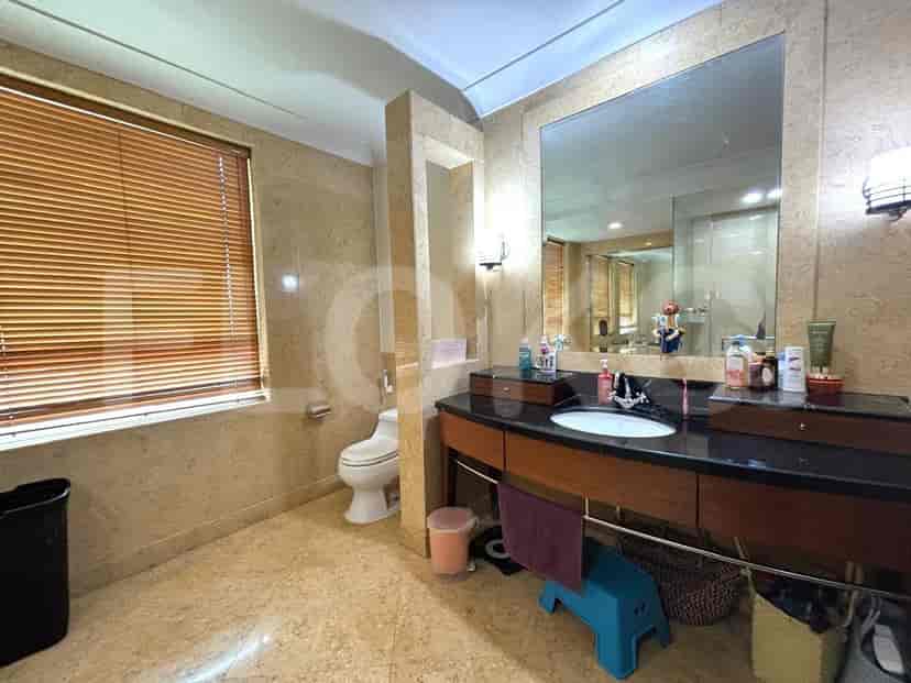 A bathroom with a sink, toilet, and shower.