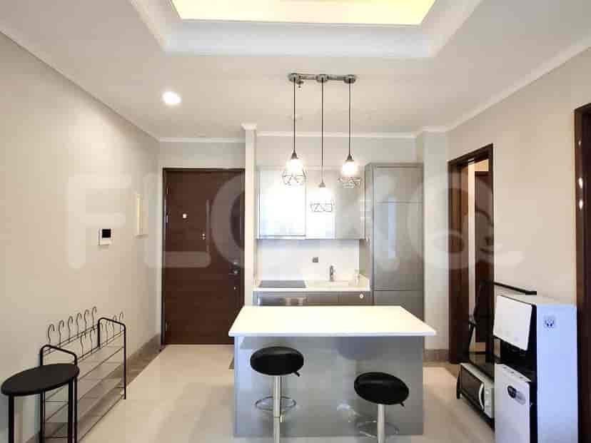 A modern bathroom with a walk-in shower, vanity, and toilet.