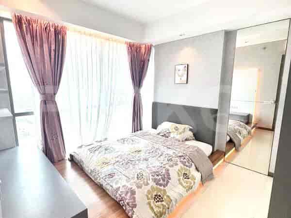 Bedroom with a queen-size bed, purple and white curtains, and mirrored closet doors.