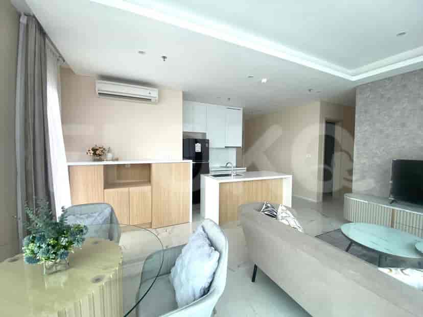 An open-plan kitchen and dining area with modern cabinets and appliances.