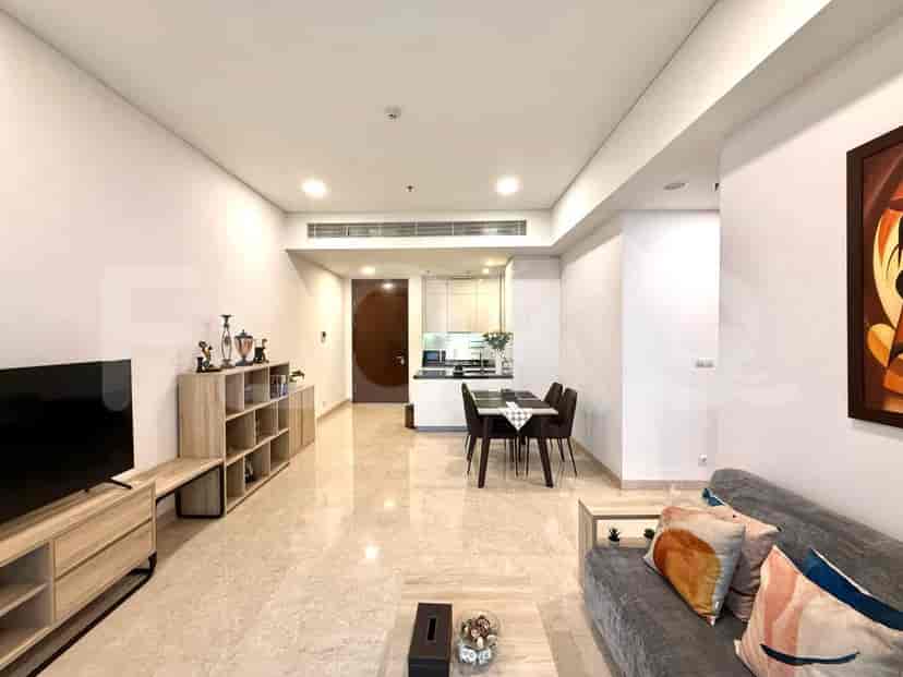 A combined kitchen and dining area with a dining table and chairs and a view into the kitchen.