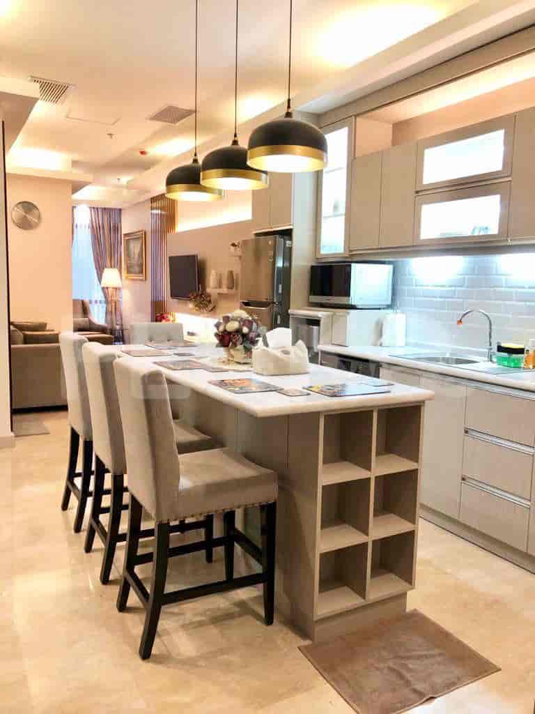 A modern kitchen layout with an island and integrated appliances.