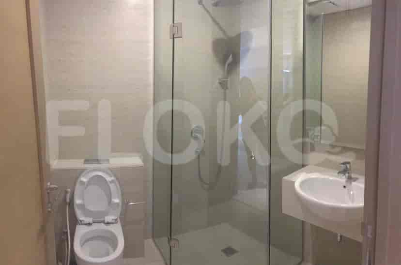 Bathroom with a glass-enclosed shower and modern fixtures.