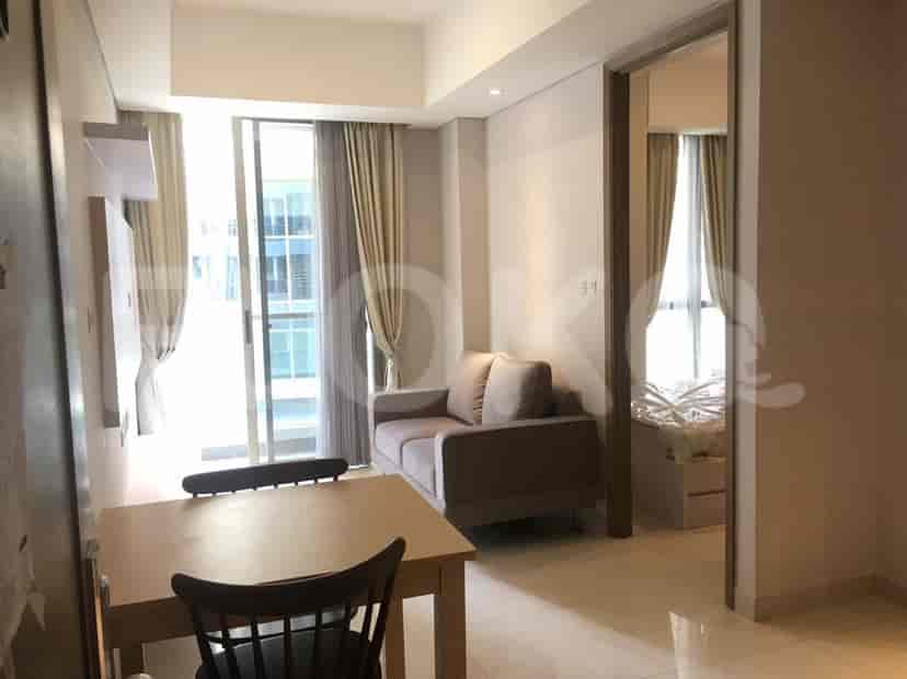 Living room with access to a balcony and an open view to the bedroom.