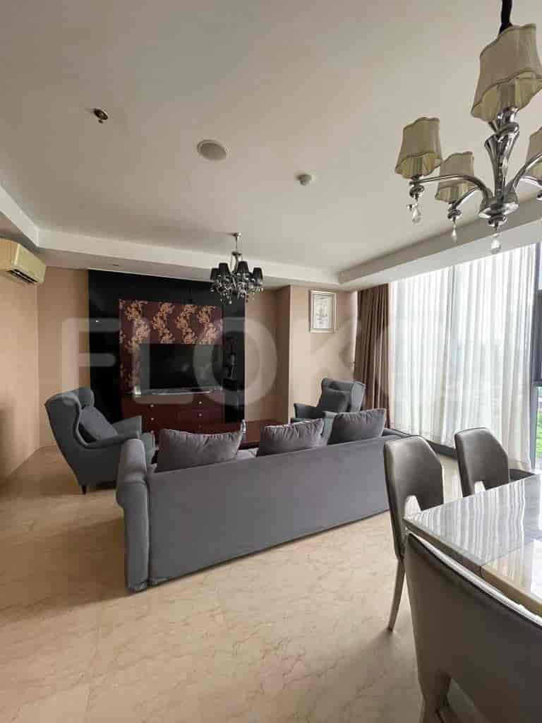 Stylish living room with a sofa and dining set, showcasing elegant decor.