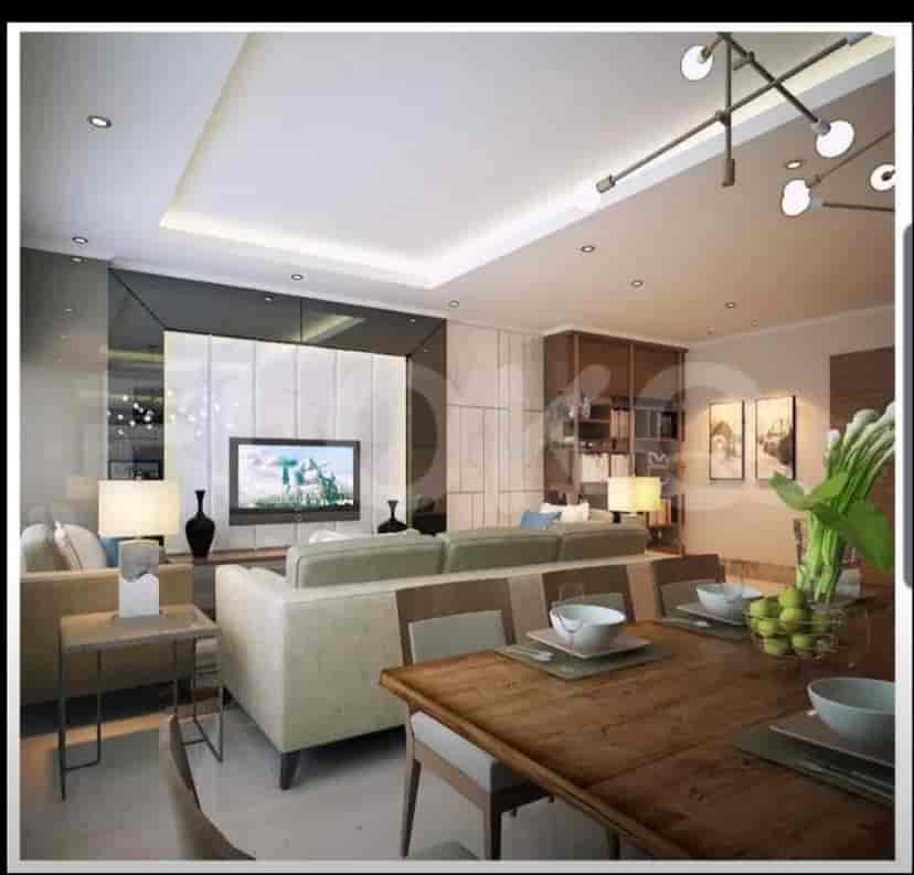 Ruang tamu dan ruang makan modern dengan sofa besar dan meja makan.