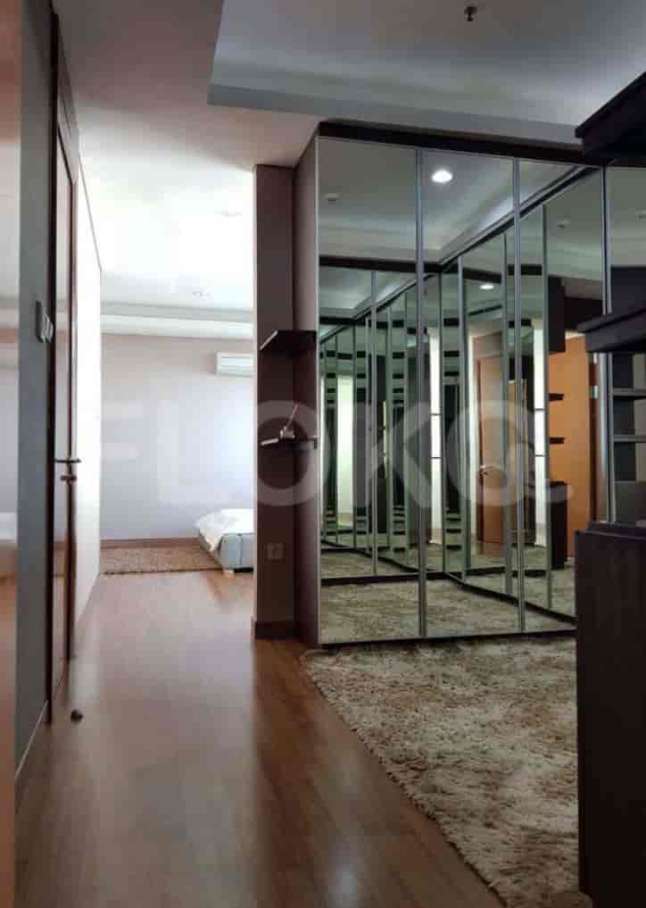 Hallway leading to a bedroom and a large closet.
