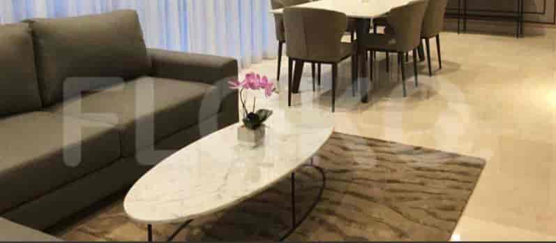 Living room with a marble-topped coffee table and a sofa.