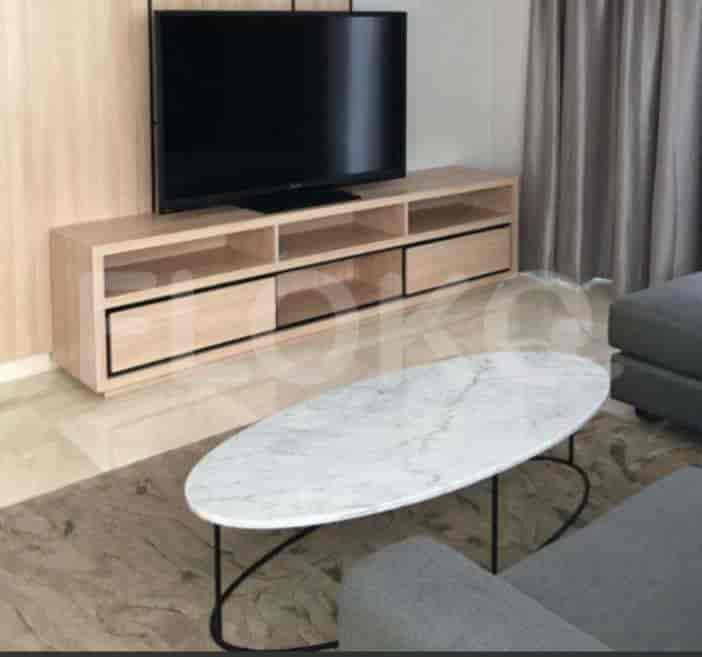 Living room with a marble-topped coffee table, a TV console, and a sofa.