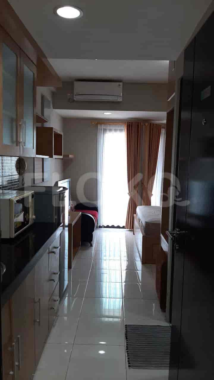 A view from the kitchen into the bedroom.