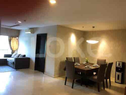 Combined living and dining space with a sofa, dining table, and air conditioner.
